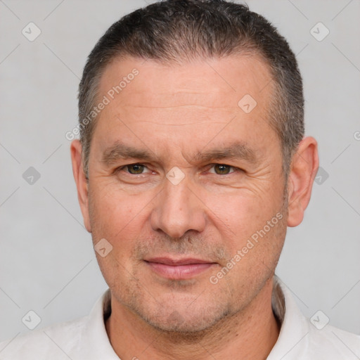 Joyful white adult male with short  brown hair and brown eyes