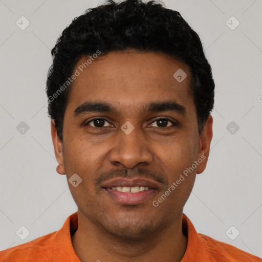 Joyful black young-adult male with short  black hair and brown eyes