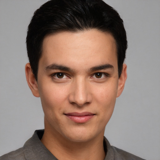 Joyful white young-adult male with short  black hair and brown eyes