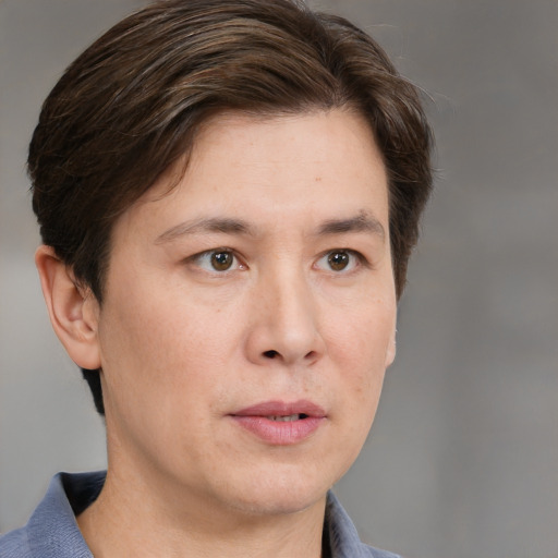 Neutral white adult male with short  brown hair and grey eyes