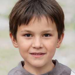 Joyful white child male with short  brown hair and brown eyes