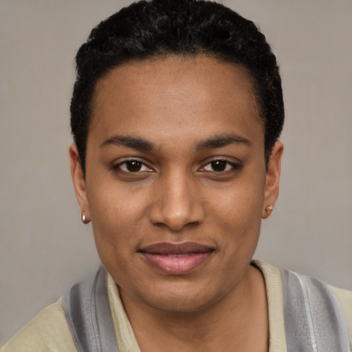 Joyful latino young-adult female with short  black hair and brown eyes