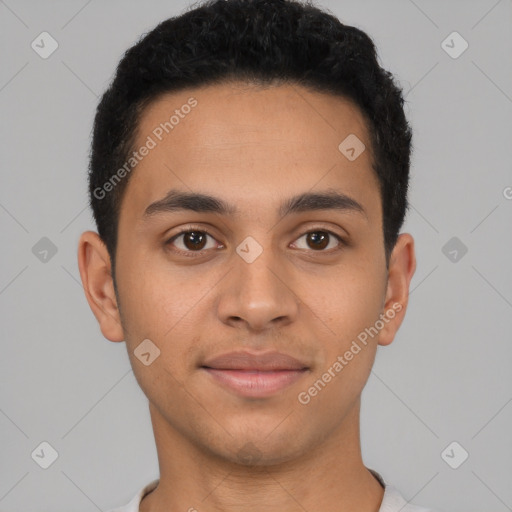 Joyful latino young-adult male with short  brown hair and brown eyes