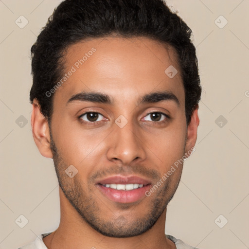 Joyful latino young-adult male with short  brown hair and brown eyes