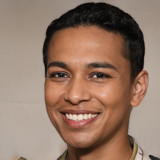 Joyful latino young-adult male with short  brown hair and brown eyes