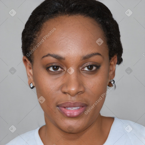 Joyful black young-adult female with short  brown hair and brown eyes