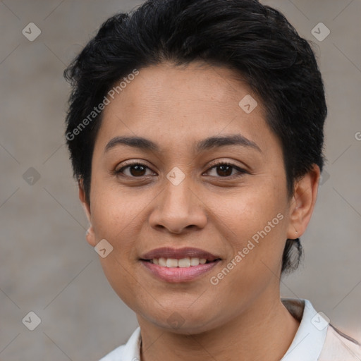 Joyful latino young-adult female with short  brown hair and brown eyes