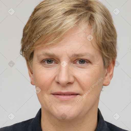 Joyful white adult female with short  brown hair and grey eyes