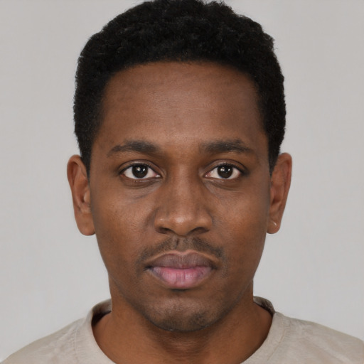 Neutral black young-adult male with short  black hair and brown eyes