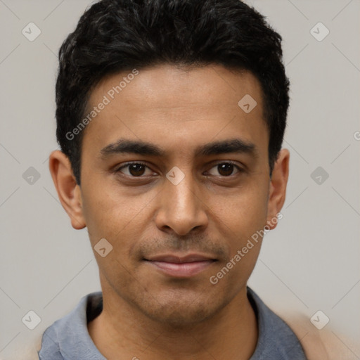Joyful latino young-adult male with short  black hair and brown eyes