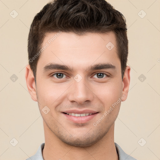 Joyful white young-adult male with short  brown hair and brown eyes