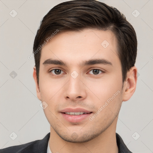 Joyful white young-adult male with short  brown hair and brown eyes