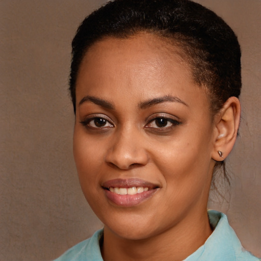 Joyful black young-adult female with medium  brown hair and brown eyes