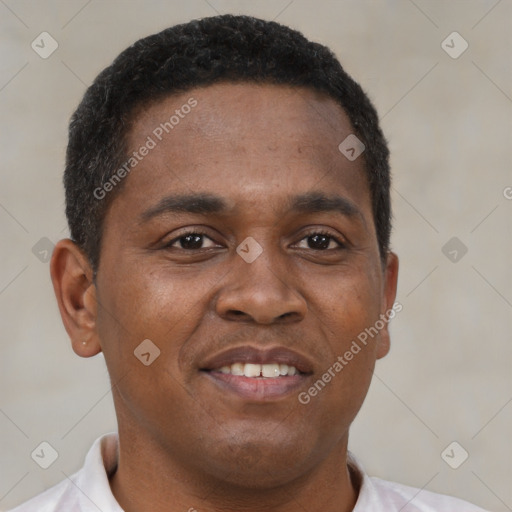 Joyful black young-adult male with short  brown hair and brown eyes