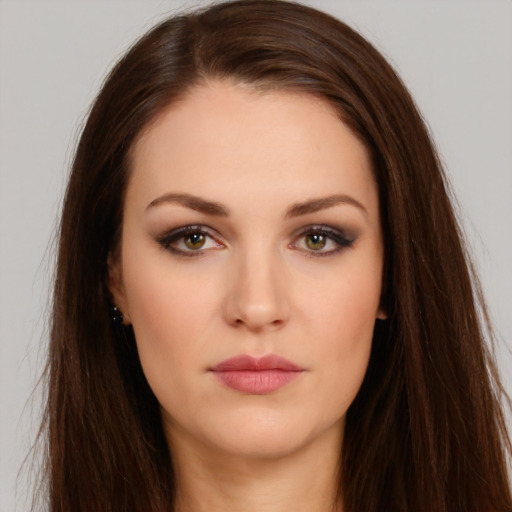 Neutral white young-adult female with long  brown hair and brown eyes