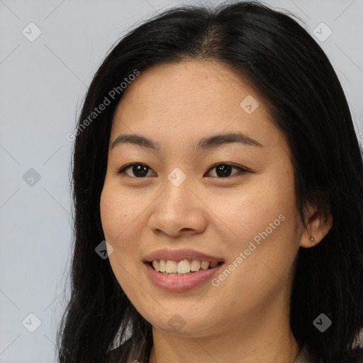 Joyful asian young-adult female with long  brown hair and brown eyes