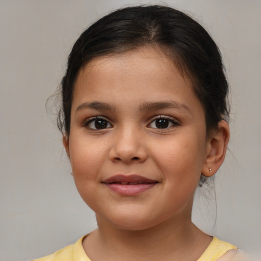 Joyful white child female with medium  brown hair and brown eyes