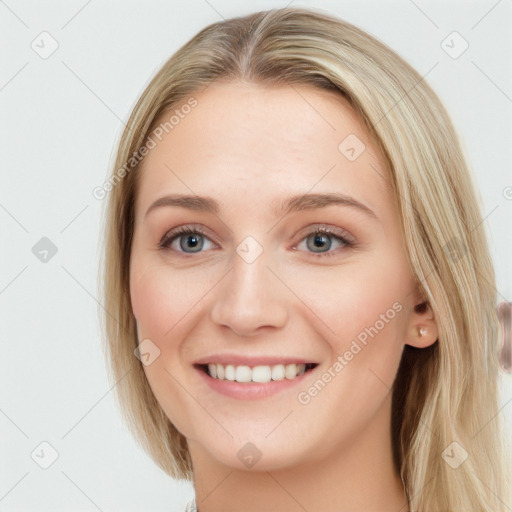 Joyful white young-adult female with long  brown hair and blue eyes