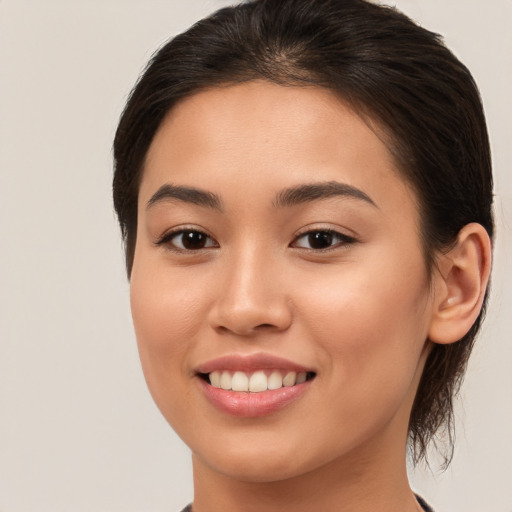 Joyful white young-adult female with medium  brown hair and brown eyes