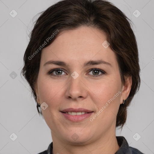 Joyful white adult female with medium  brown hair and grey eyes