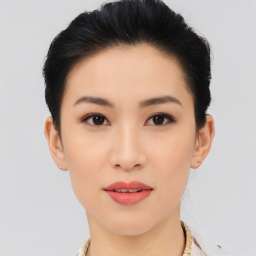 Joyful asian young-adult female with short  black hair and brown eyes