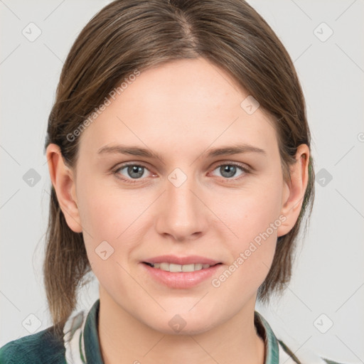 Joyful white young-adult female with medium  brown hair and grey eyes