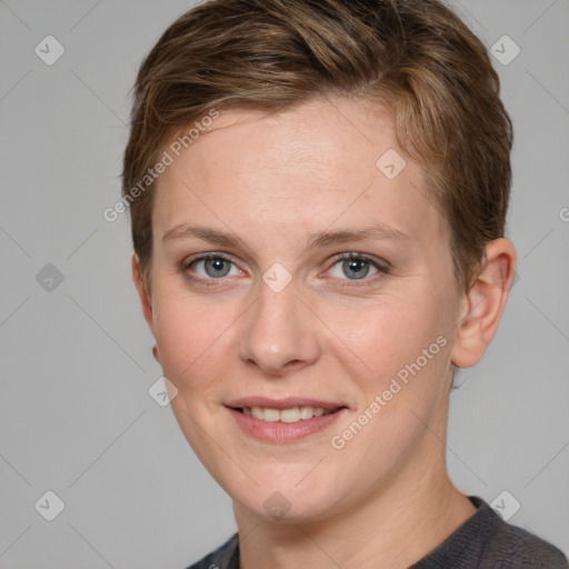 Joyful white young-adult female with short  brown hair and grey eyes