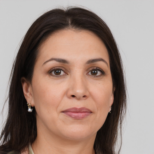 Joyful white adult female with medium  brown hair and brown eyes