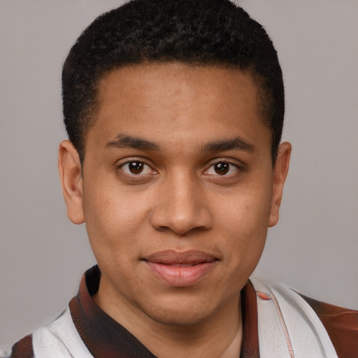 Joyful latino young-adult male with short  brown hair and brown eyes