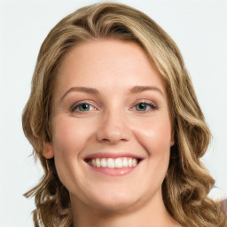 Joyful white young-adult female with long  brown hair and blue eyes