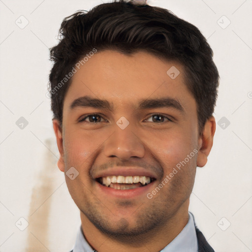 Joyful white young-adult male with short  black hair and brown eyes