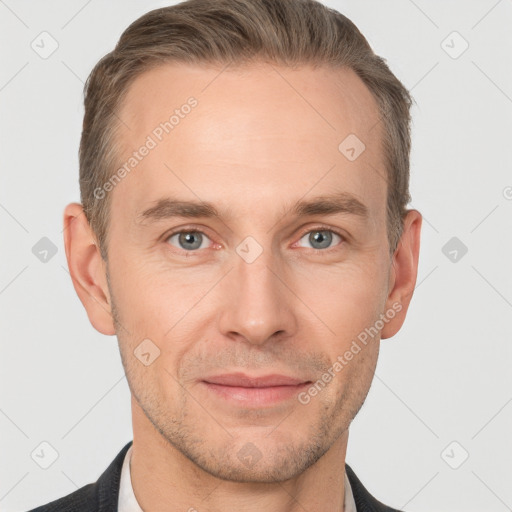 Joyful white adult male with short  brown hair and grey eyes