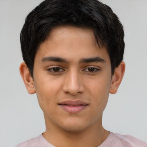 Joyful latino young-adult male with short  brown hair and brown eyes