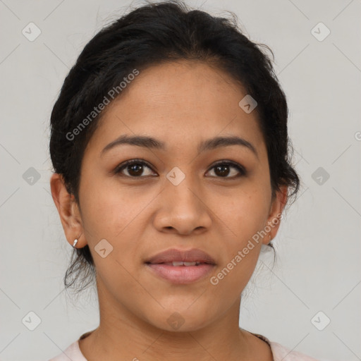 Joyful latino young-adult female with medium  brown hair and brown eyes