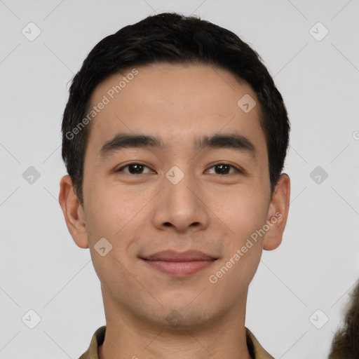 Joyful latino young-adult male with short  black hair and brown eyes