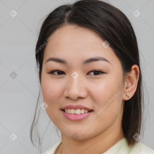 Joyful asian young-adult female with medium  brown hair and brown eyes