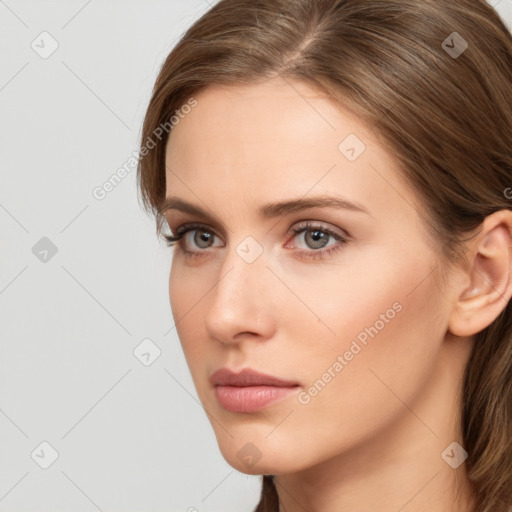 Neutral white young-adult female with long  brown hair and grey eyes