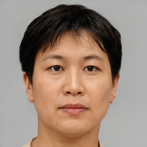 Neutral asian adult female with short  brown hair and brown eyes