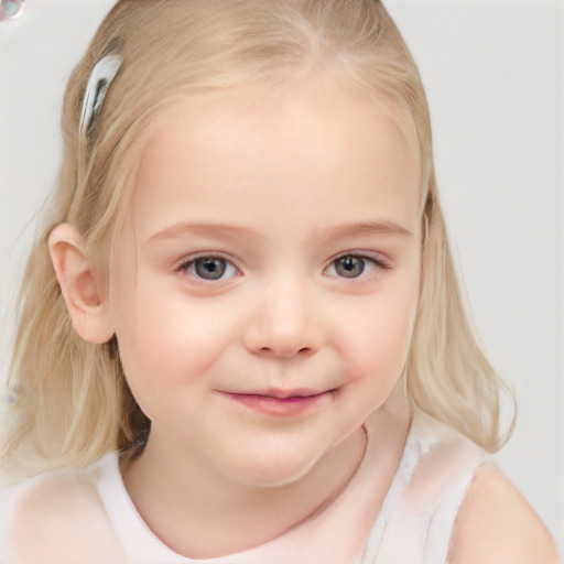 Joyful white child female with medium  blond hair and blue eyes