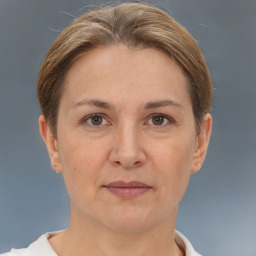 Joyful white adult female with short  brown hair and brown eyes