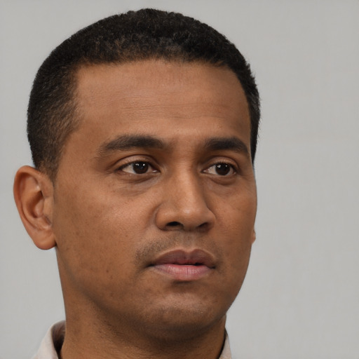 Neutral black young-adult male with short  brown hair and brown eyes