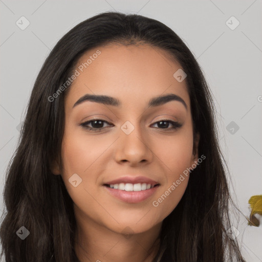 Joyful latino young-adult female with long  brown hair and brown eyes