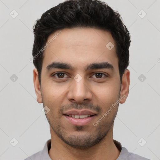 Joyful white young-adult male with short  black hair and brown eyes