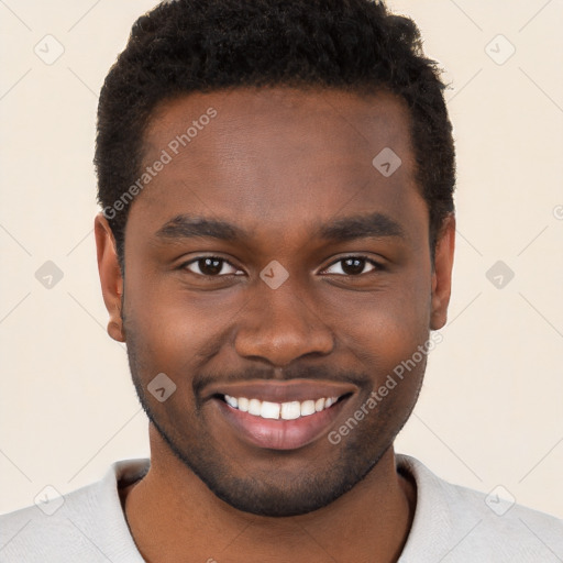 Joyful black young-adult male with short  brown hair and brown eyes