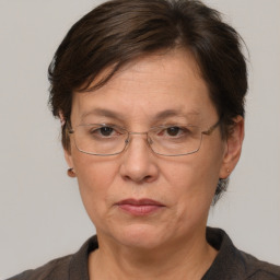 Joyful white middle-aged female with short  brown hair and brown eyes