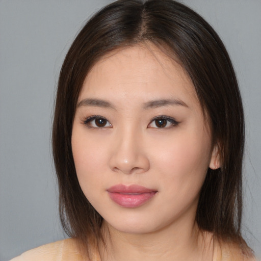 Neutral asian young-adult female with medium  brown hair and brown eyes