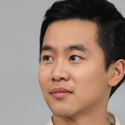 Neutral asian young-adult male with short  black hair and brown eyes