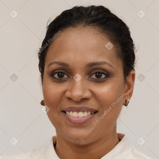 Joyful black young-adult female with short  brown hair and brown eyes