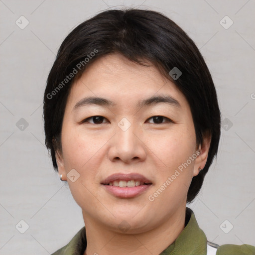 Joyful asian young-adult female with medium  brown hair and brown eyes