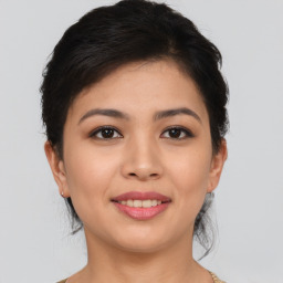 Joyful asian young-adult female with short  brown hair and brown eyes